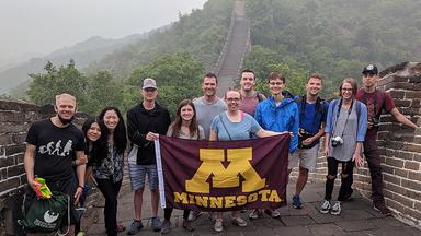 A group of UMN students stand on the Great Wall of China