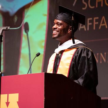 Melvin Carter stands at the podium at commencement 2024